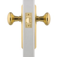 a white and gold door handle with two knobs