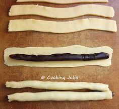 four different types of dough on a baking sheet