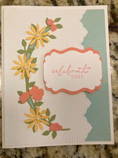 a close up of a greeting card with flowers on the front and back of it