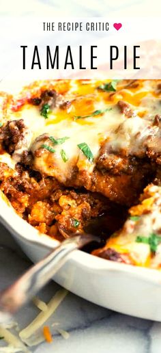 a casserole dish with meat and cheese in it on a marble table top