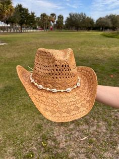 brown straw cowboy hat cowrie shell detail 100% paper Country Concert Hats, Shell Cowboy Hat, Cowgirl Hat Straw, Coastal Cowgirl Hat Ideas, Coastal Cowgirl Bride, Straw Cowboy Hat Decorating Ideas, Brown Paper Straw Fedora Hat, Brown Western Straw Panama Hat, Casual Brown Straw Hat For Western-themed Events