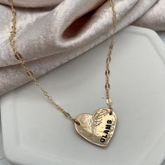 Love is always in style with our Hammered Personalized Heart Necklace. This customer favorite is ideal for initials, a date, a nickname, or a short word. The charming, vintage-style link chain is the perfect finishing touch and adds a romantic vibe. Available in sterling silver or gold finish. Chains and findings are 14kt gold fill or sterling silver. Charm is approx. 3/4 inch. Can be personalized with 6 characters max. Popular symbols for personalization are ♥ &, +(use * to symbolize the heart Pendant Name Necklace For Anniversary Gift, Rose Gold Charm Necklaces For Anniversary, Classic Charm Necklace For Anniversary, Double Heart Initials Jewelry For Anniversary Gift, Double Heart Initials Jewelry For Anniversary, Anniversary Nameplate Charm Necklace With Adjustable Chain, Initials Double Heart Jewelry For Anniversary, Vintage Personalized Open Heart Jewelry, Charming Gold Wedding Jewelry