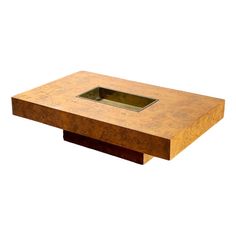 a square wooden table with a hole in the middle