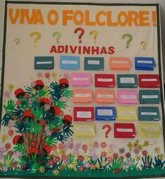 a bulletin board with flowers and question marks on the front, which reads viva o follicleore? advinhas