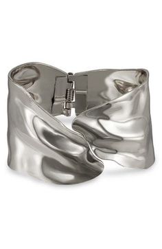 Sculptural waves catch the light on an abstract hinged cuff bracelet crafted from lightweight steel with a glossy rhodium plate. Rhodium plate Imported Statement Bracelets Cuffs, Statement Bracelets, Statement Cuff Bracelet, Over 40 Style, Summer Wardrobe Essentials, Wide Cuff Bracelets, Wedding Guest Shoes, Modern Shop, Wide Cuff