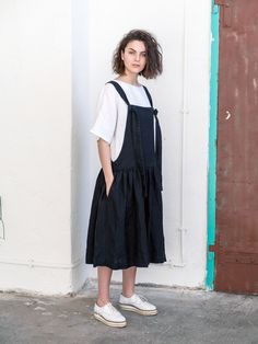 Black linen pinafore dress made of soft linen-like retro Japan-style apron, with regulated length straps and extra-wide charming skirt with side pockets for your everydays comfort. Maternity dress can be worn not only on sunny days, but you can also pair it with any favourite top or jacket. The Wide pinafore dress can be worn on many occasions with different styles of shoes and accessories. Made from washed linen, this dress will fit you on any occasion. Wear with sandals for a relaxed sense of Summer Linen Pinafore Dress, Black Cotton Pinafore Dress For Spring, Sleeveless Linen Pinafore Dress, Black Sleeveless Dress With Slip Pockets, Black Cotton Pinafore Dress For Summer, Black Daywear Dress With Slip Pockets, Black Sleeveless Summer Pinafore Dress, Black Sleeveless Pinafore Dress For Summer, Summer Bib Front Dress With Pockets