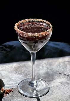 a chocolate dessert in a martini glass on a table