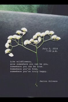 a close up of a flower on a pillow with a poem written in the middle