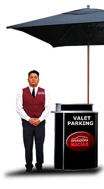 a man standing under an umbrella next to a black trash can and sign that says valet parking