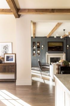 a living room filled with furniture and a fire place