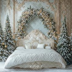 a bedroom decorated for christmas with white bedding and gold trimmings, surrounded by trees