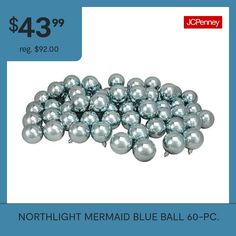 a pile of silver balls with the price $ 3 99 on it and an ad for ice