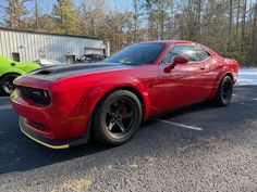 HEMI 6.2L Supercharged V8 engine, producing an impressive 807 horsepower and 707 ft. lbs. of torque. The factory default features of this vehicle are top-of-the-line, including Brembo brakes, adaptive damping suspension, launch control, and a high-performance cooling system. The exterior is a Torch Red, complemented by a sleek Black interior. With less than 7,000 miles on the odometer, this vehicle has been driven an average of less than 2,000 miles per year and is in excellent overall condition. Davis4x4.com