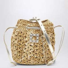 This chic beige crochet bucket bag is your new everyday companion. Perfectly blending casual elegance with a hint of sparkle, it's versatile enough for both brunch and a night out. Plus, it's roomy enough for all your essentials. Drawstring fastening Adjustable and removable leather and metal shoulder strap Small feet for stability Rhinestone logo buckle on the front Silver-tone metal hardware | Roger Vivier Women's Crochet Très Vivier Bucket Bag in Beige | RBWANME2100TQZ Beige Crochet, Bucket Handbags, Mini Bucket, Crochet Woman, Roger Vivier, Leather Cap, Leather Bucket Bag, Leather Bucket, Metal Hardware