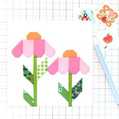 a piece of paper with flowers on it next to a pencil and some other crafting supplies