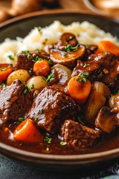 a close up of a plate of food with meat and potatoes