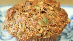 a muffin is sitting on a blue and white plate