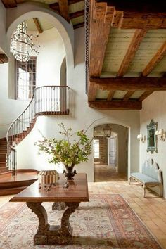 a living room filled with furniture and a staircase