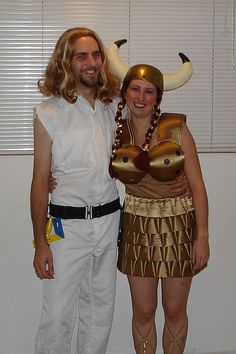 a man and woman dressed up in costumes