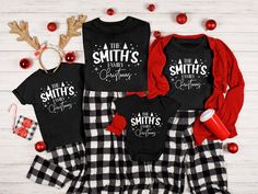 three matching family christmas outfits with reindeer antlers on the top and plaid pants,