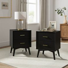 two black nightstands sitting on top of a white rug next to a window in a living room