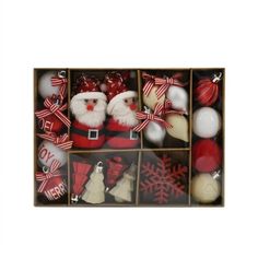 an assortment of christmas ornaments in a box with santa clause and snowflake decorations