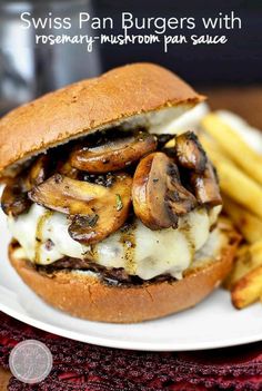 a mushroom burger on a plate with french fries