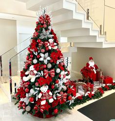 a christmas tree decorated with red and white decorations