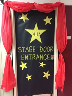 a door decorated with yellow stars and red drapes that says stage door entrance on it