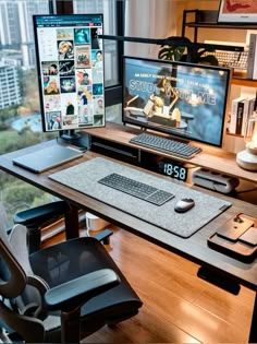 a computer desk with two monitors and a keyboard on it in front of a window