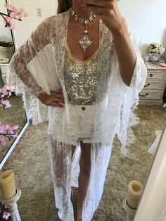 Welcome to the Suzi Rose designs shop Website: www.suzirose.com Instagram: suzi_rose_designs Design details - White lace kimono robe in a beautiful soft flowing french style lace. - Designed for a lose fit. Perfect for the bride to wear on the wedding day over a white slip (We also sell the slips separately) or perfect for any beach holiday or amazing piece to throw over an outfit for the festival seasons - Kimono comes with a white satin belt sash so you can close the robe around the waist - St Fitted White Wedding Kimono, Lace Wedding Kimono With Kimono Sleeves, White Free Size Cover-up For Festivals, White Free Size Festival Cover-up, White Open Front Kimono For Festival, Bohemian Lace Cover-up For Party, Wrap Kimono For Spring Wedding, Bohemian Lace Party Cover-up, Spring Party Kimono With Open Front