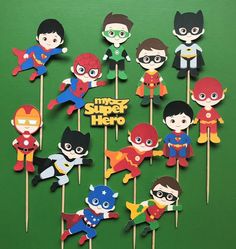 a bunch of cupcake toppers with superheros on them