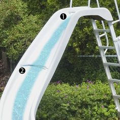 a water slide with instructions on how to install it in the backyard or garden area