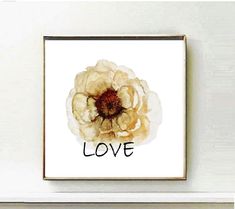 a white flower with the word love written on it