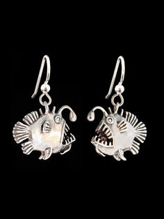 These whimsical Angler Fish Earrings are cast in sterling silver and are completely solid and three dimensional.  Each earring charm is 1" (25 mm) long, detailed both front and back and can stand freely on it's lower fins. May this ugly but personable fish amuse and delight you! Beauty is in the eyes of the beholder.This item usually ships the same or next business dayAll Marty Magic Jewelry is packaged in a beautiful  box, embossed with the gold foil Marty Magic dragon logo. Perfect for any occ Silver Fish-shaped Earrings With Ear Wire, Handmade Silver Fish-shaped Earrings, Handmade Sterling Silver Fish-shaped Jewelry, Handmade Sterling Silver Fish Jewelry, Silver Fish-shaped Earrings With Fish Hooks, Nickel-free Silver Fish-shaped Earrings, Silver Fish-shaped Sterling Silver Earrings, Silver Sterling Fish-shaped Earrings, Angler Fish Art