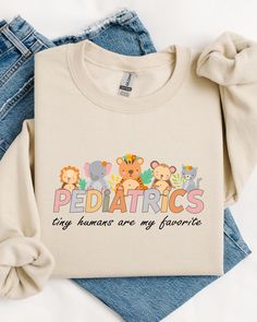 Pediatrics Animal Sweatshirt, Tiny Human Are My Favorite Hoodie, Pediatrics Sweatshirt, PEDS Sweatshirt, Peds Nurse Shirt, Pediatric Nurse Gift - Backside design is additional fee, plies  sure to add the fee into your purchase. - If you want to add or change anything on the existing design that we show in the display picture, please contact with the seller from message box to ask if the changes and additional request can be done or not, if you do not ask and request for it without asking in the order we will ship the item as it is without the requests done. - Please check the color charts for the size and type of the t-shirts you want, not every color is available for each type of t-shirts, drop down comes automatically with every color but they are not available for each item so please ma Pediatric Er Nurse, Pediatric Nurse Shirt, Halloween Pediatrics Shirts, Pediatric Nurse Shirts, Pediatric Occupational Therapy Shirts, Animal Sweatshirt, Types Of T Shirts, Pediatric Nursing, Tiny Humans