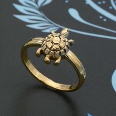 * Free Surprise Gift on Purchase of 1 Product. * Purchase of 4 Product and Get 2 Rings Free Gifts. Product :- Ring Material :- Brass/925 Sterling Silver Size :- All Size Available  Gold Turtle Ring,Over Sea Ring, Unisex Ring,Minimal Tortoise Ring,Cute Animal Ring,Tortoise Ring, Good Luck Ring, Ocean Ring, Vermeil Ring,    * All our products are handmade and we make them as you see in the    photography but because of handmade There may be a slight difference in them * Handling Time: We take handling time of 1-3 Business Day from the date of receipt of the payment * Shipping Services: The shipping company takes 5-15 business days to deliver the product to US and most of other countries       For any queries Please feel free to message us. * Normally we respond in maximum 24 hours. * Gift pa Gold Tortoise Ring, Sea Ring, Tortoise Ring, Sea Rings, Ocean Ring, Turtle Ring, Ring Minimal, Animal Ring, 2 Rings