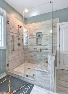 a bathroom with a walk in shower next to a window