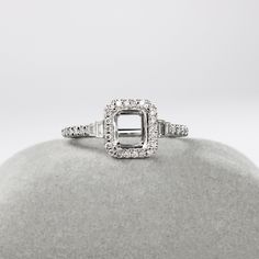 This beautiful ring semi mount features an emerald cut basket with natural baguette and round earth mined diamonds, all set in solid 14K gold. This ring setting is perfect for the center gemstone of your choice and can be a lovely birthstone gift for your loved ones! This ring semi mount is made with solid 14K Gold and natural Earth mined SI / G-H diamonds. Classic Rectangular Diamond Ring With Halo Setting, Classic Rectangular Halo Diamond Ring, Rectangular Diamond Jewelry With Halo Setting, White Gold Baguette-cut Jewelry With Side Stones, Fine Jewelry With Baguette Cut Side Stones, Classic Jewelry With Baguette Cut Side Stones, White Gold Baguette Cut Jewelry With Side Stones, Baguette Cut White Gold Jewelry With Side Stones, Elegant Baguette Cut Jewelry With Side Stones