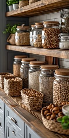 many jars and baskets are lined up on the shelves