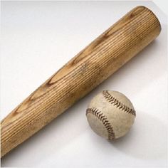 a baseball bat and a ball on a white surface