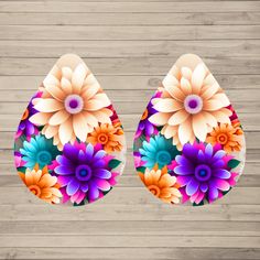 an easter egg decorated with colorful flowers on a wooden background, ready to be cut into smaller pieces