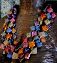 Five strands of multi-colored diamond shaped agates adorn this Unisex Statement Necklace. Each Agate is individually knotted for added protection should the necklace ever break. Round black onyx beads separate the front from the back silk corded section. Non-adjustable 26" length with a gold tone magnetic clasp. From the Atelier of Kat Kouture. Will make a great gift for that special someone or just to treat yourself! Lightweight and comfortable to wear! Jewellery Shop Design, Turquoise Western, Silk Cord, Onyx Bead, Western Jewelry, Bracelet Crafts, Diamond Shaped, Cuff Earrings, Magnetic Clasp