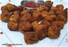 fried food on a plate with dipping sauce