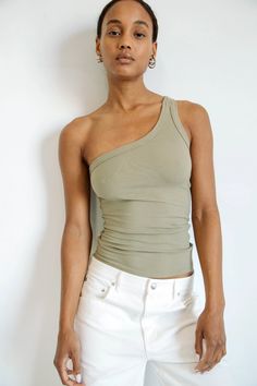 DRISS TANK TOP ARTICHOKE – The Line by K High Stretch Off-shoulder Summer Tops, One Shoulder Top With Built-in Bra And Stretch, Seamless Sleeveless One Shoulder Top, Seamless One-shoulder Fitted Top, Seamless Fitted One-shoulder Top, Fitted One-shoulder Seamless Top, Seamless Fitted Sleeveless One Shoulder Top, Chic Seamless One Shoulder Top For Spring, Fitted Seamless Sleeveless One Shoulder Top