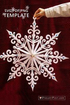 a snowflake that is being held up by someone's hand with the words,