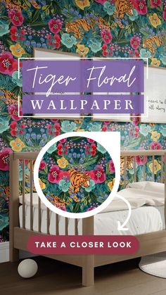 the tiger floral wallpaper is next to a crib with a bed in it