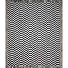 a black and white rug with wavy waves on the front, fringes in the back