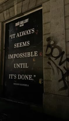 a sign on the side of a building that says it always seems impossible until it's done