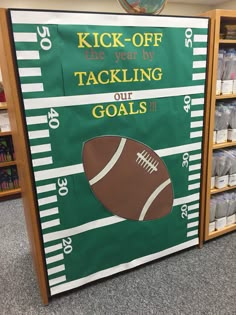 a green and white football banner with the words kick - off the year by tacking our goals